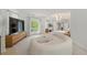 Bright and open living space with a modern fireplace, television, large windows and comfortable curved seating at 1079 Arbor Ne Trce, Atlanta, GA 30319