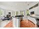 Open floorplan with bar area, exercise space, fireplace, and natural lighting from bay windows at 1079 Arbor Ne Trce, Atlanta, GA 30319