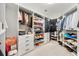 Organized walk-in closet with shelving and storage for clothing, shoes, and accessories at 1079 Arbor Ne Trce, Atlanta, GA 30319
