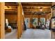 Unfinished basement featuring exposed wood framing, natural light from windows, and a door to the outside at 29 Laurelwood Nw Ln, Cartersville, GA 30121