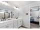 Bathroom boasting double vanity, modern lighting, and a glass shower at 29 Laurelwood Nw Ln, Cartersville, GA 30121