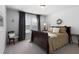 Bedroom with warm brown color scheme, good window light, and neutral grey walls and carpet at 29 Laurelwood Nw Ln, Cartersville, GA 30121