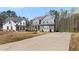 Exterior view of two homes featuring long driveways, nicely manicured landscapes and classic, stylish architecture at 29 Laurelwood Nw Ln, Cartersville, GA 30121