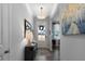 Bright foyer with hardwood floors, decorative lighting and a stylish console table, leading into the home at 29 Laurelwood Nw Ln, Cartersville, GA 30121