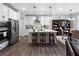 Modern kitchen features a large island, stainless steel appliances, and stylish pendant lighting at 29 Laurelwood Nw Ln, Cartersville, GA 30121