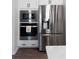 Bright kitchen features stainless steel appliances including a refrigerator, microwave, and oven at 29 Laurelwood Nw Ln, Cartersville, GA 30121