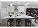 Bright kitchen features a large island with seating and stylish pendant lighting at 29 Laurelwood Nw Ln, Cartersville, GA 30121