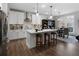 Bright kitchen boasts white cabinetry, a center island, and access to the outdoor patio at 29 Laurelwood Nw Ln, Cartersville, GA 30121