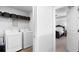 Bright laundry room featuring modern appliances and convenient shelving at 29 Laurelwood Nw Ln, Cartersville, GA 30121