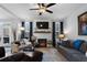 Bright living room with a fireplace, large windows, and comfortable seating, creating a welcoming atmosphere at 29 Laurelwood Nw Ln, Cartersville, GA 30121