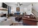 Inviting living room with a fireplace, plush seating, and a ceiling fan at 29 Laurelwood Nw Ln, Cartersville, GA 30121