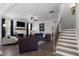 Spacious living room with hardwood floors, a fireplace, and plenty of seating for entertaining guests at 29 Laurelwood Nw Ln, Cartersville, GA 30121