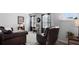 Comfortable living room with leather furniture, neutral walls, and natural lighting at 29 Laurelwood Nw Ln, Cartersville, GA 30121