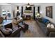 Cozy living room with a fireplace, large windows, and a comfortable seating arrangement at 29 Laurelwood Nw Ln, Cartersville, GA 30121