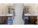 Bathroom featuring dual vanity, matching mirrors and cabinets, with wood-look flooring at 346 M J Mccarthy Way, Hampton, GA 30228