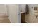 This bathroom features a patterned wallpaper and decorative fixtures at 346 M J Mccarthy Way, Hampton, GA 30228
