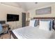 Cozy bedroom with large bed, soft pillows, and wall-mounted television at 346 M J Mccarthy Way, Hampton, GA 30228