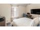 Bright bedroom with a desk area, comfortable bed, and modern television at 346 M J Mccarthy Way, Hampton, GA 30228