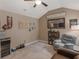 Charming bonus room with varied decor, a plush recliner, and a ceiling fan at 346 M J Mccarthy Way, Hampton, GA 30228