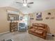 Bonus room featuring varied decor, a leather loveseat, grey recliner, vaulted ceiling, and natural light at 346 M J Mccarthy Way, Hampton, GA 30228