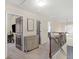 View of the hallway, with a bedroom and other rooms visible from the upstairs landing at 346 M J Mccarthy Way, Hampton, GA 30228