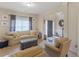 Comfortable living room featuring a plush sofa, armchairs, and natural light at 346 M J Mccarthy Way, Hampton, GA 30228