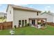 A backyard featuring a pergola-covered patio and fire pit at 6350 Lantana Village Way, Cumming, GA 30028