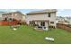 Spacious backyard with a pergola and fire pit, perfect for outdoor living at 6350 Lantana Village Way, Cumming, GA 30028