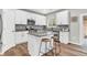 Modern kitchen features granite countertops, stainless steel appliances and center island with seating at 6350 Lantana Village Way, Cumming, GA 30028