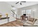 Bright living room featuring a staircase, a workspace, and lots of natural light at 6350 Lantana Village Way, Cumming, GA 30028