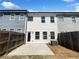 Private backyard with a concrete patio and partial fencing, perfect for outdoor enjoyment at 7109 Gladstone Cir, Lithonia, GA 30038