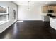 Bright dining area with hardwood floors, natural light, and modern pendant lighting at 7109 Gladstone Cir, Lithonia, GA 30038