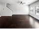 Spacious living room with dark wood floors, neutral walls and lots of natural light at 7109 Gladstone Cir, Lithonia, GA 30038