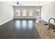 Expansive living area boasting hardwood floors, neutral walls, and ample natural light at 7109 Gladstone Cir, Lithonia, GA 30038