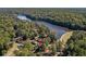 Stunning aerial view of the property surrounded by lush greenery and serene lake waters at 1025 Martins Lake Close, Roswell, GA 30076