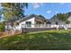 Charming home featuring a well-maintained backyard, a spacious deck, and an inviting outdoor space at 1025 Martins Lake Close, Roswell, GA 30076