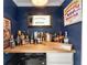 Home bar area featuring a floating countertop and shelving at 1025 Martins Lake Close, Roswell, GA 30076