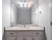 Elegant bathroom featuring light countertops, vanity with drawers, and large mirror at 1025 Martins Lake Close, Roswell, GA 30076