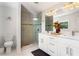 Bright bathroom with a glass shower, double vanity with modern fixtures and bright natural light at 1025 Martins Lake Close, Roswell, GA 30076