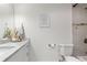 Bright bathroom with marble countertops, modern fixtures, and a shower with modern tile at 1025 Martins Lake Close, Roswell, GA 30076