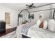 Bright bedroom with a canopy bed, modern decor, and an attached bathroom, creating a comfortable and functional space at 1025 Martins Lake Close, Roswell, GA 30076