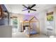 Bright bedroom featuring a small bed with window views and an accent wall at 1025 Martins Lake Close, Roswell, GA 30076