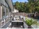 Outdoor deck featuring an outdoor seating area, a dining table, grill, and playground visible in the background at 1025 Martins Lake Close, Roswell, GA 30076
