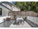 Outdoor deck area featuring a dining set, grill, and heater, perfect for outdoor gatherings and relaxation at 1025 Martins Lake Close, Roswell, GA 30076