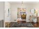 Stylish entryway with hardwood floors, modern lighting, and an open view into the dining area at 1025 Martins Lake Close, Roswell, GA 30076