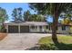Inviting home with a neatly maintained front yard and a convenient two-car garage at 1025 Martins Lake Close, Roswell, GA 30076