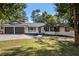Charming home with a well-manicured lawn, a welcoming front porch, and a two-car garage, offering curb appeal at 1025 Martins Lake Close, Roswell, GA 30076