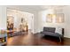 Inviting living room featuring hardwood floors, modern decor, and a comfortable seating area at 1025 Martins Lake Close, Roswell, GA 30076