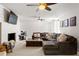 Spacious living room featuring a brick fireplace, modern lighting, and neutral color scheme at 1025 Martins Lake Close, Roswell, GA 30076