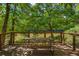 Community picnic table on a deck overlooking the river provides a serene spot for outdoor dining and relaxation at 1025 Martins Lake Close, Roswell, GA 30076